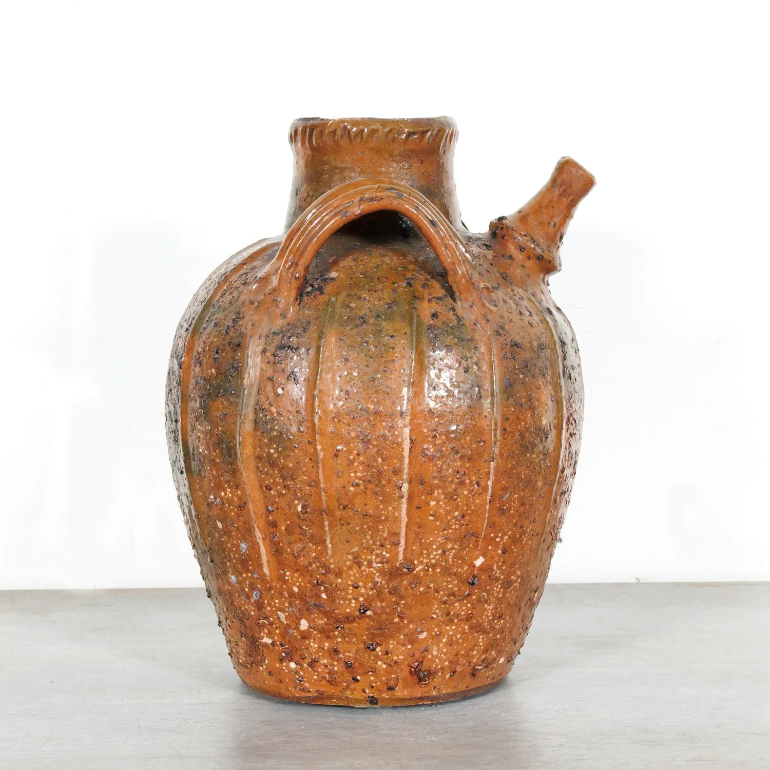 Rare 19th Century French Terracotta Walnut Oil Jug with Orange Glaze