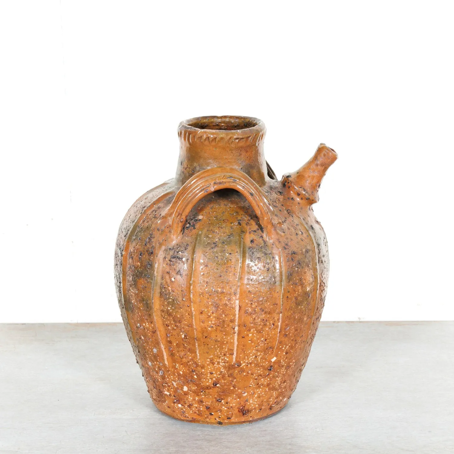 Rare 19th Century French Terracotta Walnut Oil Jug with Orange Glaze