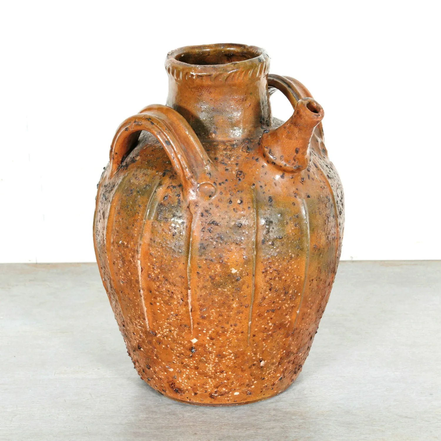 Rare 19th Century French Terracotta Walnut Oil Jug with Orange Glaze