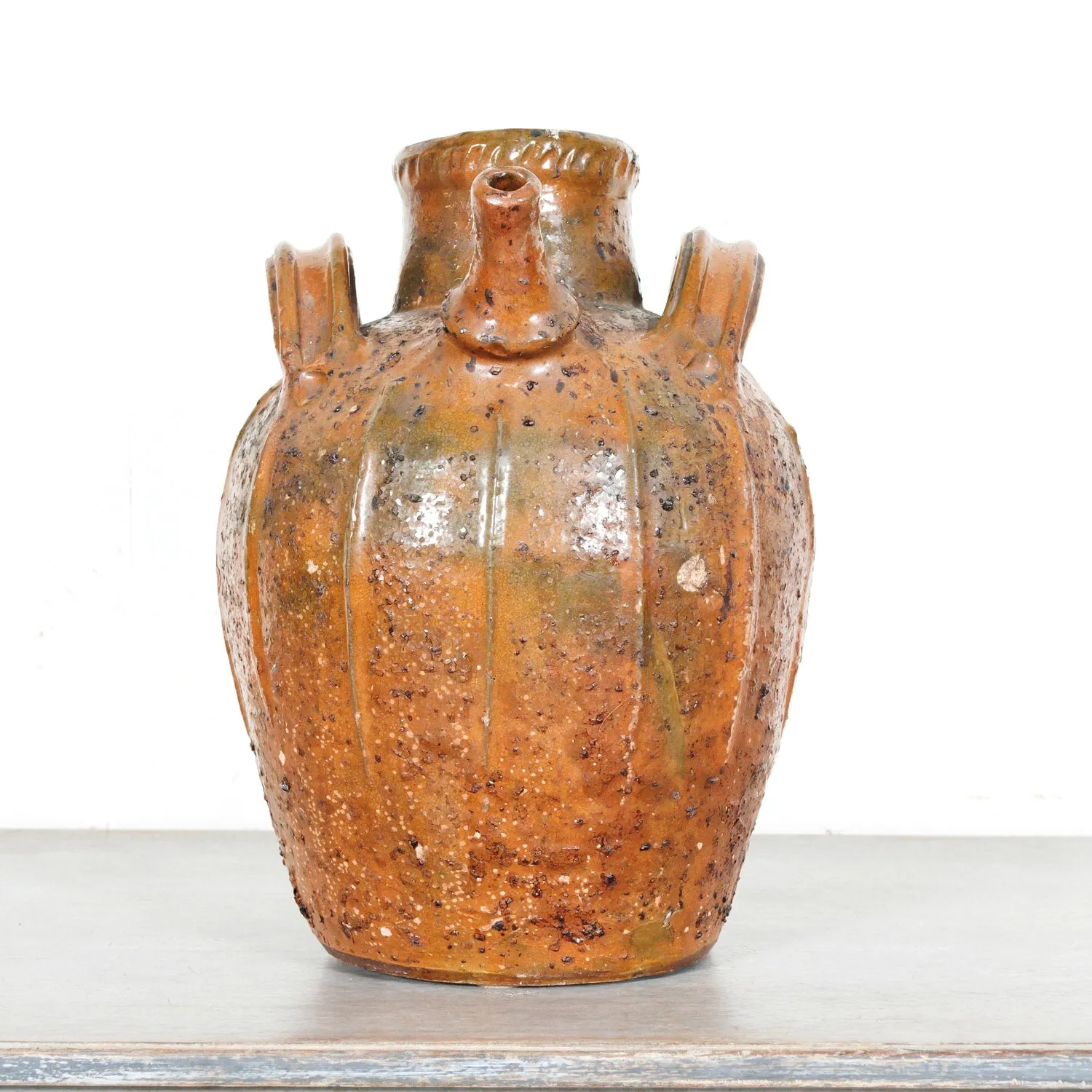 Rare 19th Century French Terracotta Walnut Oil Jug with Orange Glaze